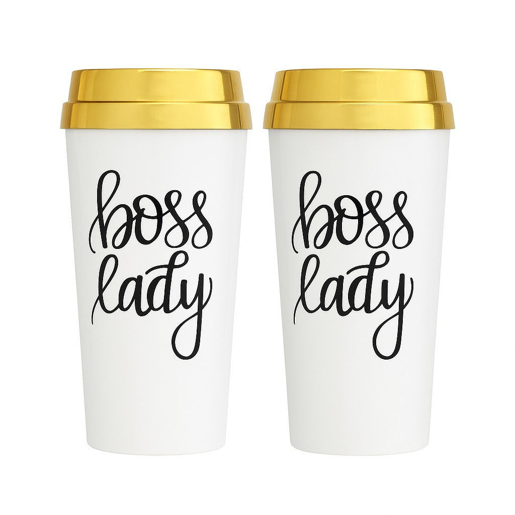 Two white travel mugs with gold lids and 'boss lady' text on a white background