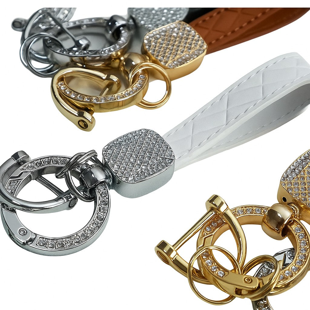 Gold, silver, and white keychains with decorative elements on a white background