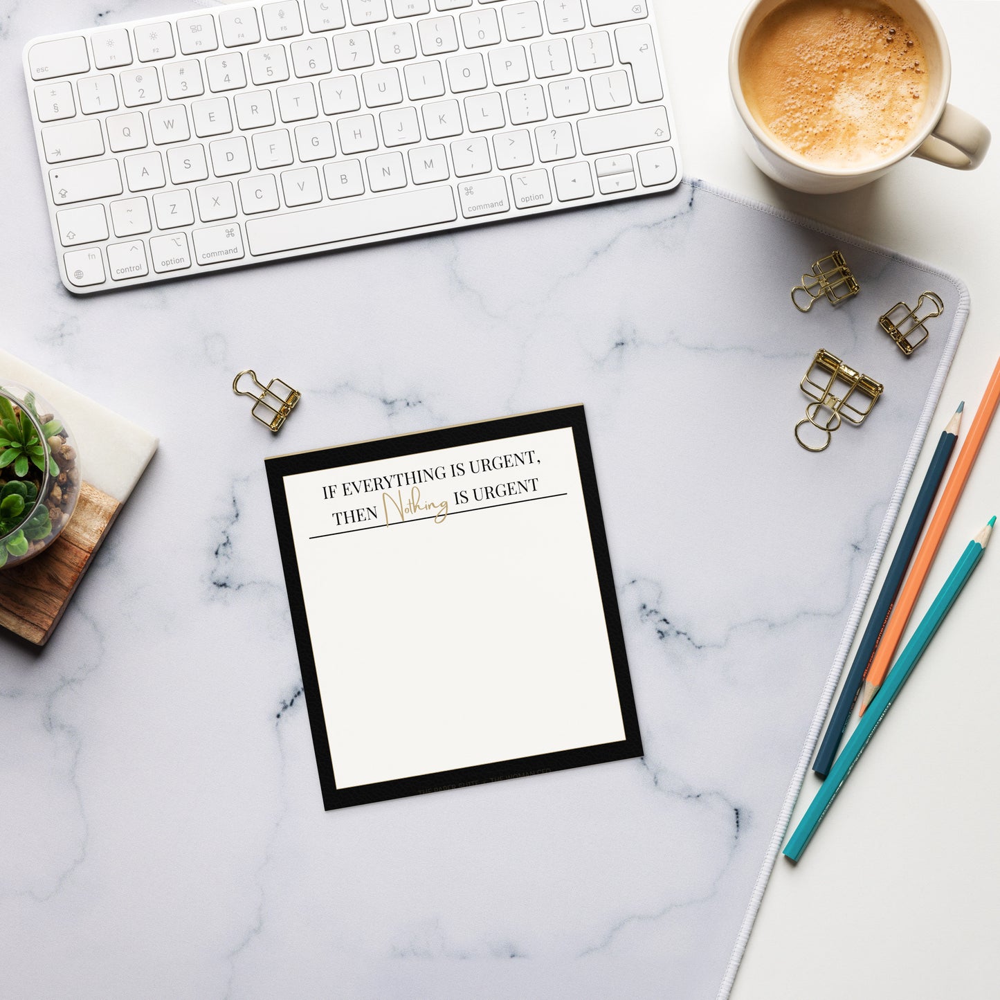 Minimalist notepad featuring the quote “If everything is urgent, then Nothing is urgent” with the word “Nothing” in elegant gold script. The notepad has a warm white background, black leather-textured border, and a clean tear-away layout. Branding at the bottom reads “The Paper Suite × The Woman CFO.”